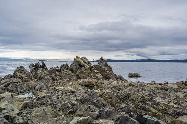 Free Photo beautiful shot of rocky cliff near sea under a sky