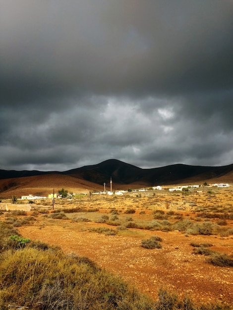 Beautiful shot of sandy dry lands before the storm in Corralejo Natural Park, Spain