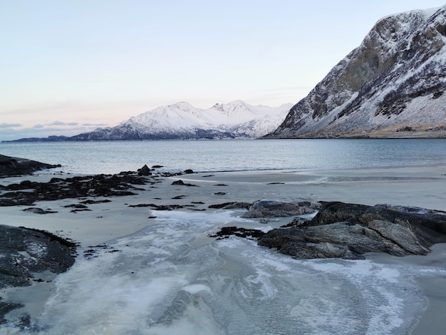 Beautiful shot of snowy mountains and scenery in Kvaloya Island of Norway