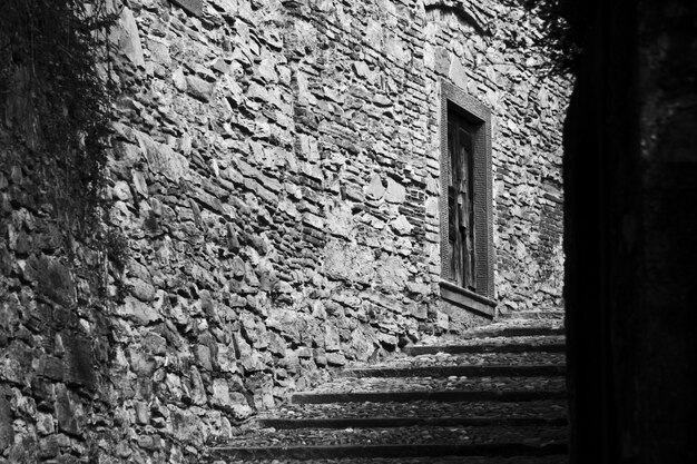 Beautiful shot of a stairway in the middle of buildings in black and white