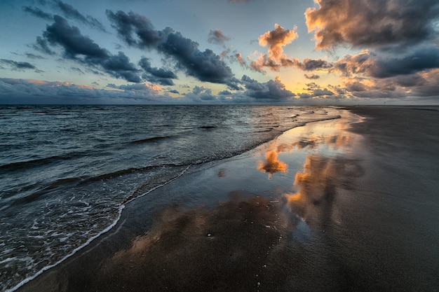 Beautiful shot of the sunset reflecting in the sea