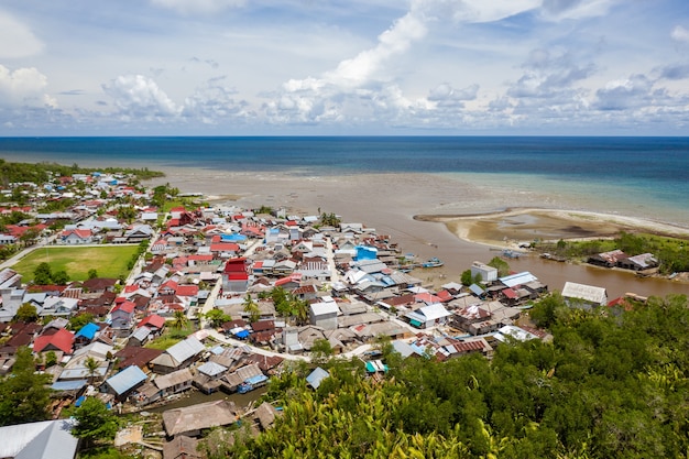 Beautiful shot of the town near the shore of a calm sea in Mentawai islands, Indonesia