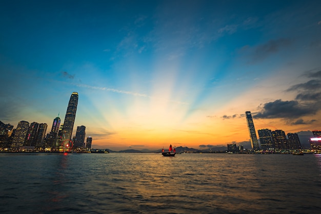 Beautiful shot of an urban city modern architecture with the breathtaking sky and a lake