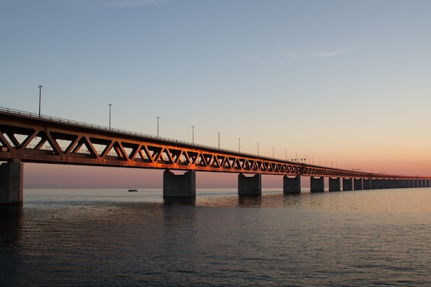 Beautiful shot of the Utsiktspunkt Öresundsbron bridge over the water under a blue sky