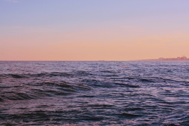 Beautiful shot of the waves of the sea during a sunny day at the beach