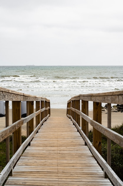 Free Photo beautiful shot of a wooden walkway on the beach