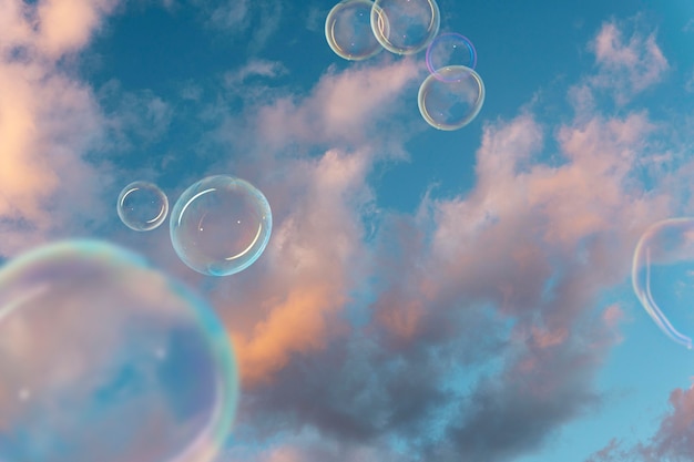 Free photo beautiful sky landscape and soap bubbles