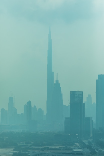 Free Photo beautiful skyline of dubai surrounded by sand dust at day light