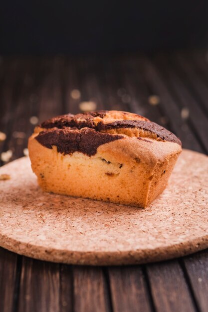 Beautiful small cake on wooden table