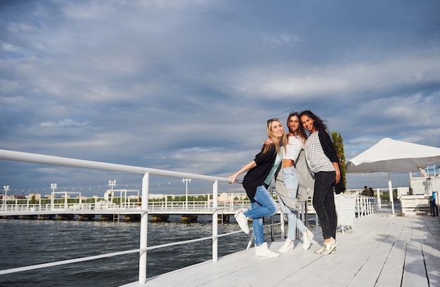 Free Photo beautiful smiling girls posing photographer. positive emotions.