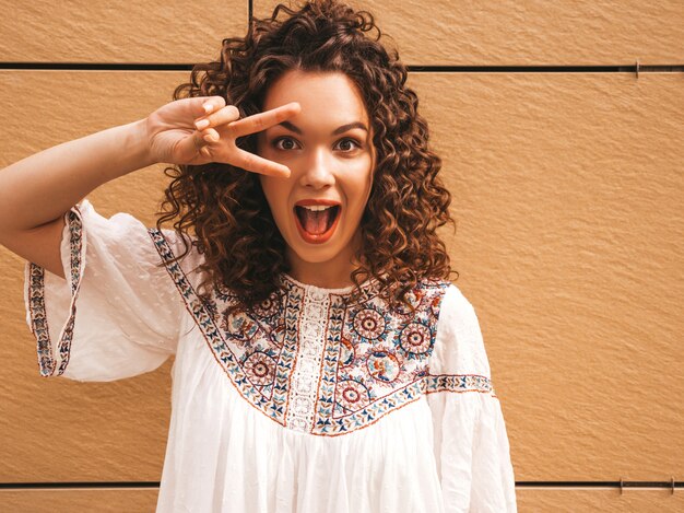 Free Photo beautiful smiling model with afro curls hairstyle dressed in summer hipster white dress.