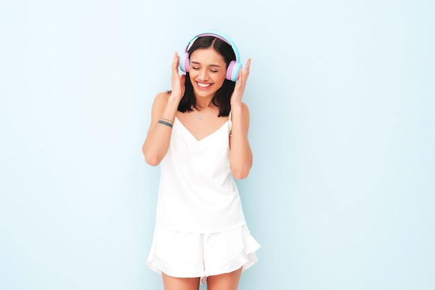 Beautiful smiling woman dressed in white pajamas