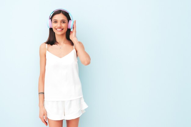 Beautiful smiling woman dressed in white pajamas