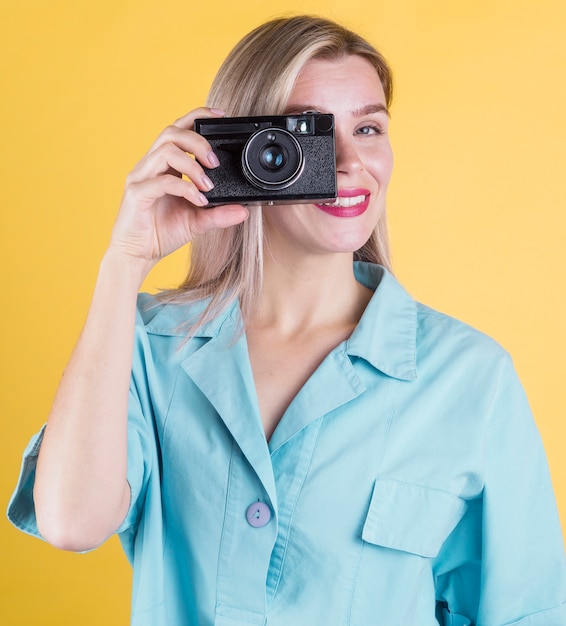 Beautiful smiling woman taking a photo