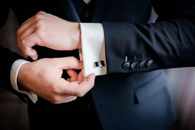 Free photo beautiful stylish groom's cufflinks on the shirt