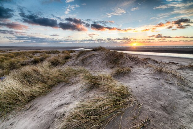 Beautiful sunrise at the beach creating the perfect scenery for morning walks at the shore