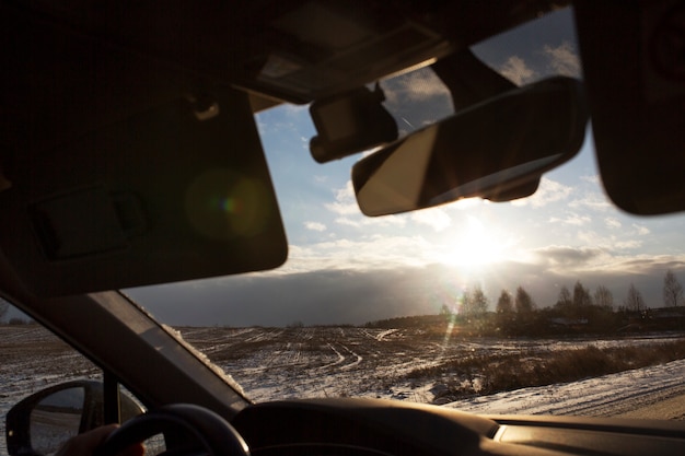 Free photo beautiful sunrise through the windshield