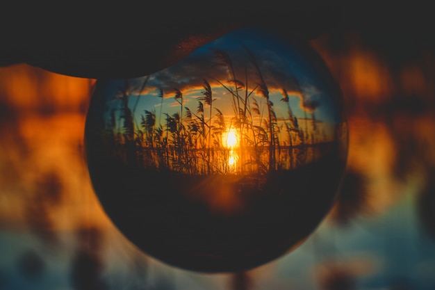 Free photo beautiful sunrise upside-down view from a crystal ball perspective