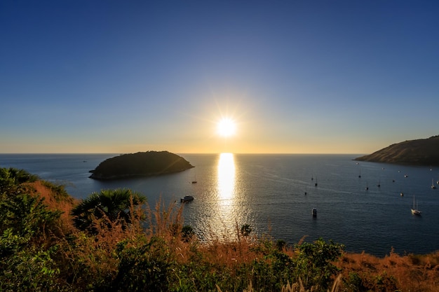 Beautiful sunset on Andaman sea at Windmill View Point near Laem Promthep Cape Phuket Thailand