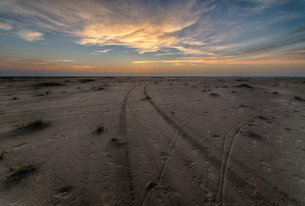 Beautiful sunset at the beach creating the perfect scenery for evening walks at the shore