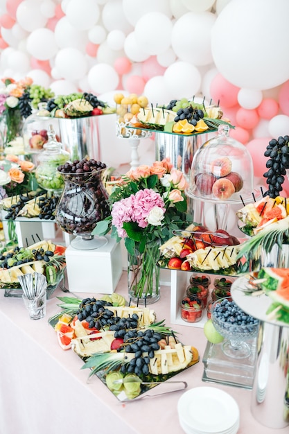 Beautiful table with sweets and fruits for guests