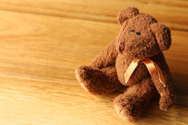 beautiful teddy bear on a wooden surface