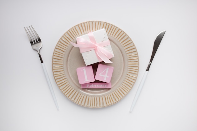 Beautiful top view table setting for Valentines on white