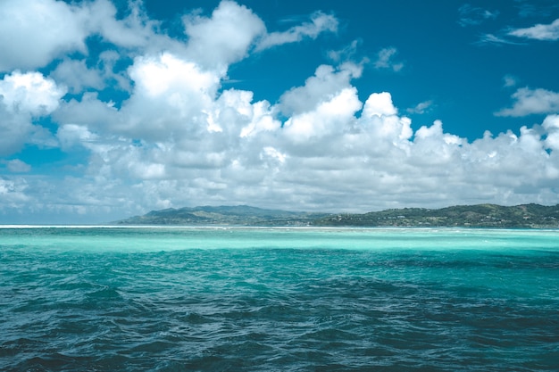 Beautiful tropical beach near the shore with huge waves