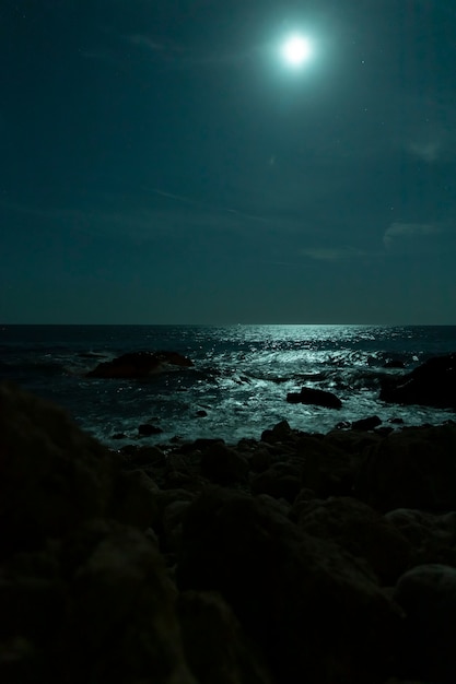 Free Photo beautiful tropical beach with full moon in night skies