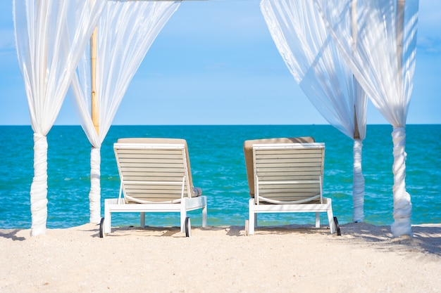 Free photo beautiful umbrella and chair around beach sea ocean with blue sky for travel