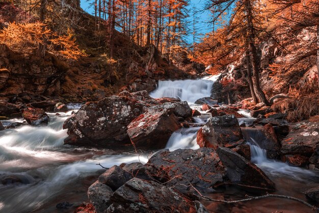 Beautiful view of the autumn landscape and a waterfall in a forest