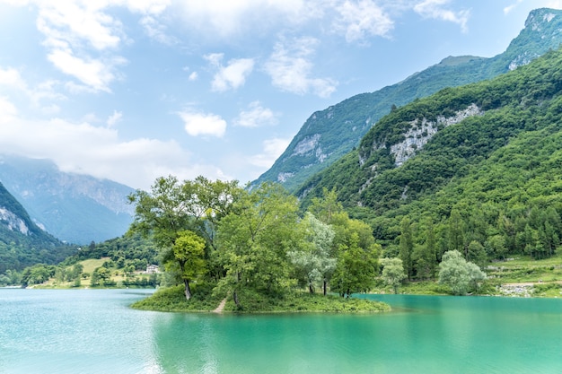 Beautiful view of the calm lake of Tenno, located in Trentino, Italy during daylight