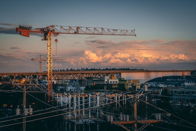 Free photo beautiful view of a construction site in a city during sunset