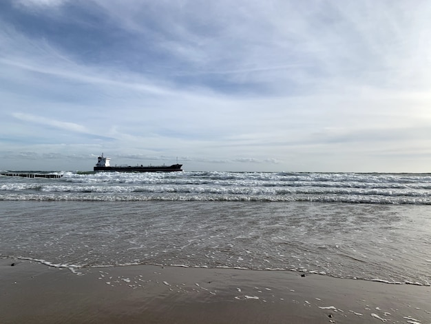 Beautiful view from a sea with a ship at the horizon