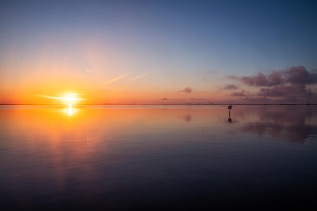 Beautiful view of the golden sunset sky over the ocean