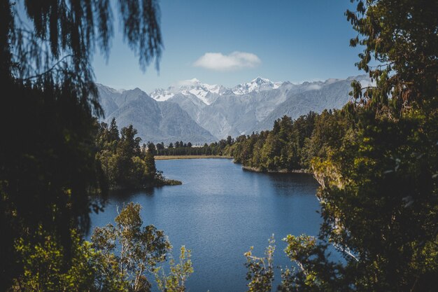 Beautiful view of lake matheson in new zealand with a clear blue sky in the background