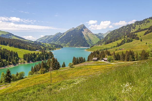 Beautiful view of a lake surrounded by mountains in Longrin lake and dam Switzerland, Swissalps