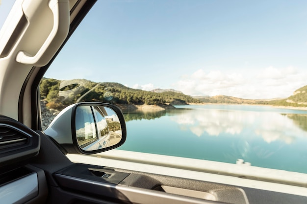 Free photo beautiful view of nature lake from car