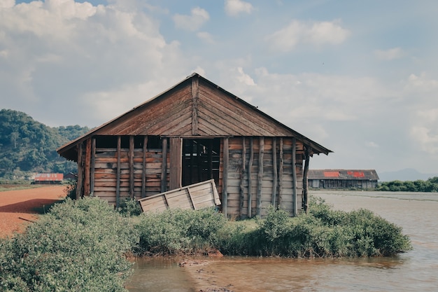 Beautiful view of an old wooden barn in the countryside near the lake