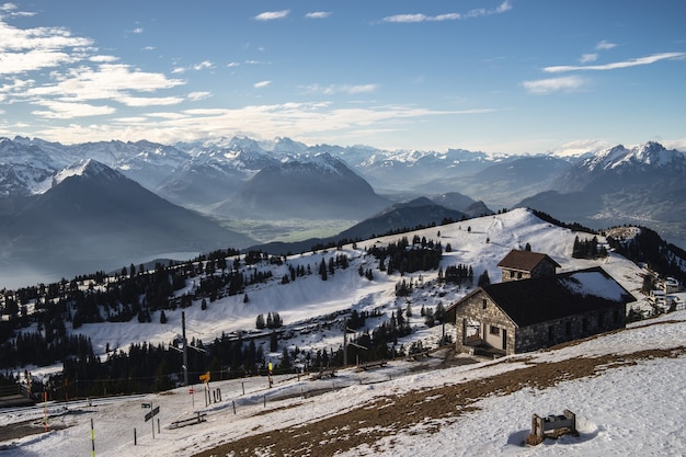 Beautiful view of the Rigi mountain range on a sunny winter day with brick buildings