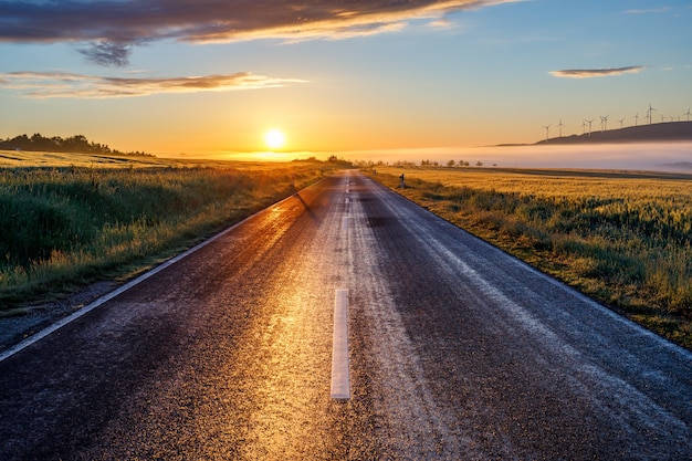 Free photo beautiful view of a road at sunrise in the early morning