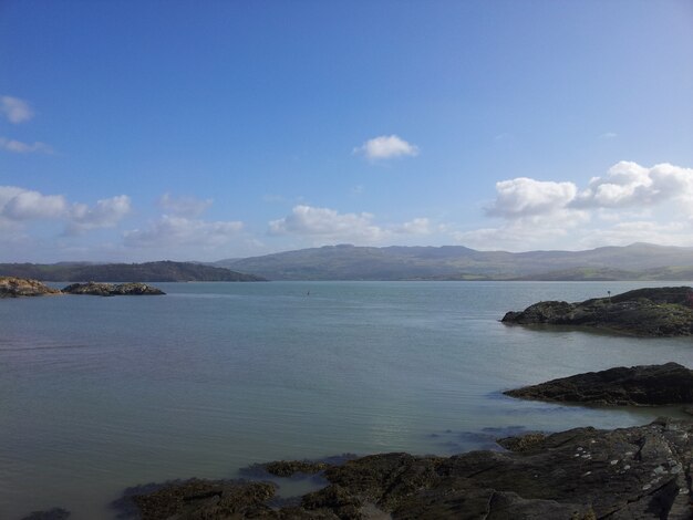 Beautiful view of the sea and the rocky shore with the mountains