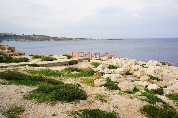 Beautiful view of a shore of the ocean under the blue sky