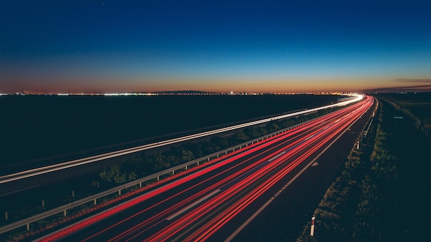 Beautiful view of transportation lights on the road at night time