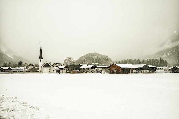 Beautiful view of a winter village under snowfall