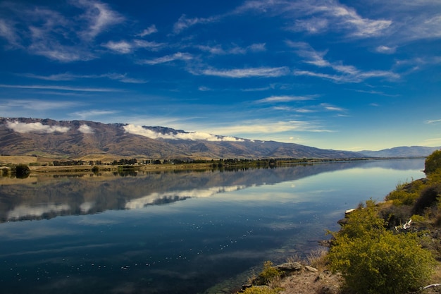 Beautiful water reflection of Nelson Lake in National Park of Braeburn New Zealand