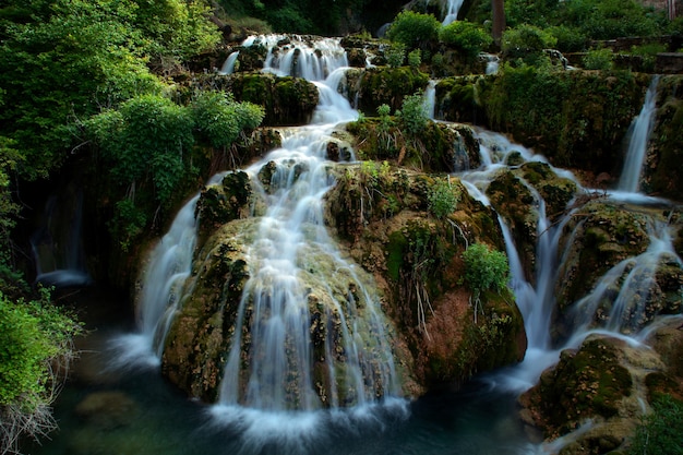 Beautiful waterfall flowing through a lush green forest