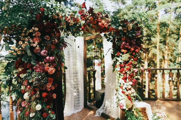 Free Photo beautiful wedding altar made of garland of spearworts and greene