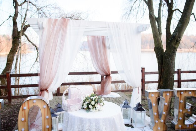 Beautiful wedding altar made of white and pink curtains