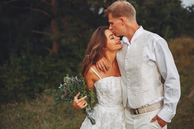 Free Photo beautiful wedding couple in a summer field